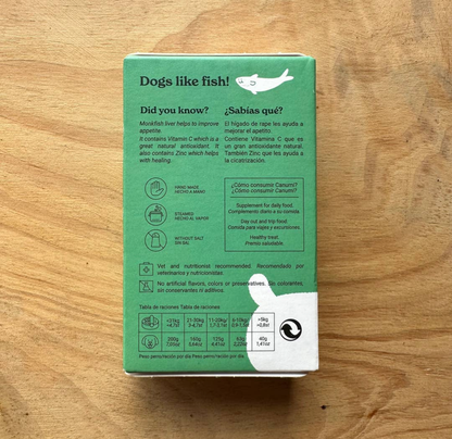 Image shows the back of Canumi Monkfish Liver packaging on a neutral wooden background.