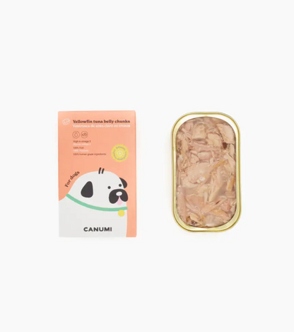 Image shows an open tin of Canumi tuna belly chunks next to red packaging box on a white background. 