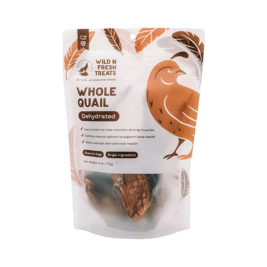Wild N Fresh Treats Whole Quail Dehydrated dog treats in a 4 oz resealable stand-up pouch. The packaging features a brown and white design with an illustration of a quail and a photo of the dehydrated bird treats visible through a clear window at the bottom.